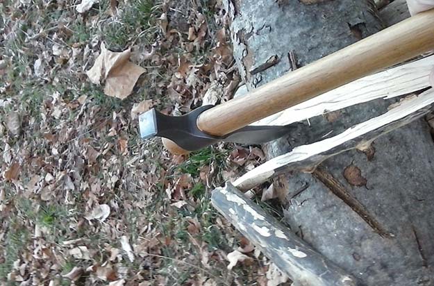 splitting wood with a tomahawk