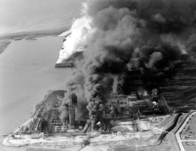 Refineries and oil storage tanks of the Monsanto chemical plant burn in the waterfront area in Texas City, Texas, on April 16, 1947. The disaster, caused by the explosion of the nitrate-laden French ship Grandcamp, caused 561 deaths. (AP Photo)