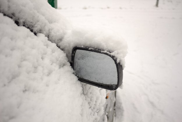 car-in-snow-mirror-showing Winter Storm Warning! Surviving a Winter Storm Trapped Outside