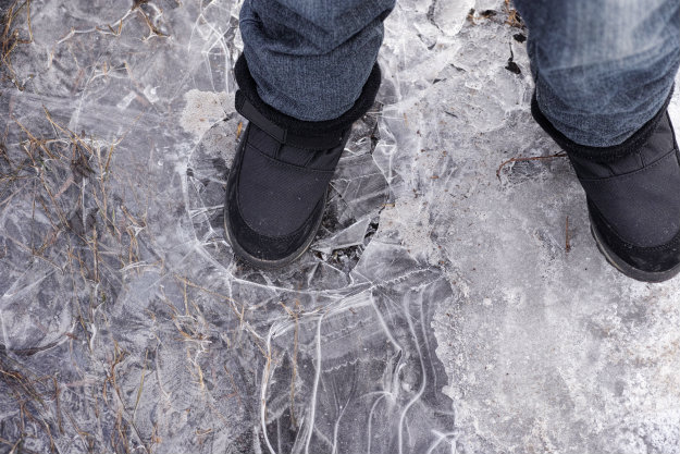 foot-cracking-thin-ice Thin Ice Ahead! How To Rescue Someone Who Has Fallen Through Ice