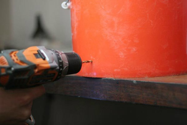 Step 10: Drill a 3/8 inch hole in the bucket. | How To Make A Moonshine Still