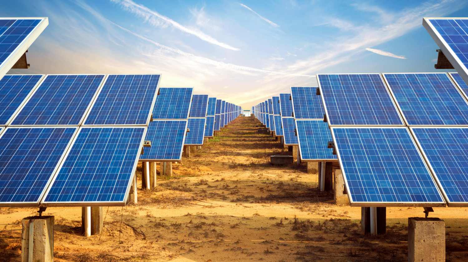 Solar panel farm lined up under the sky | Why You Need To Try Solar Power | Featured