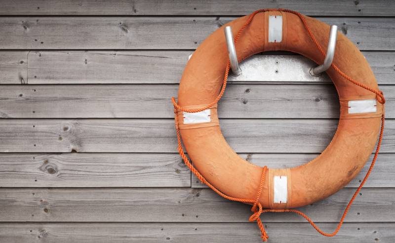 red-lifebuoy-rope-on-weathered-wooden hurricane survival
