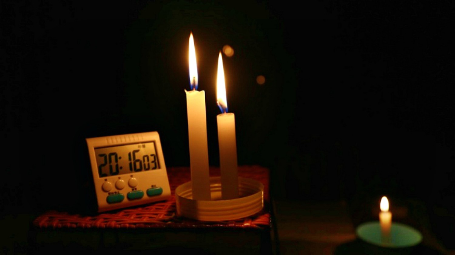 Feature | Burning Candle beside clock in the table | Power Outage: What To Do When The Power Goes Out