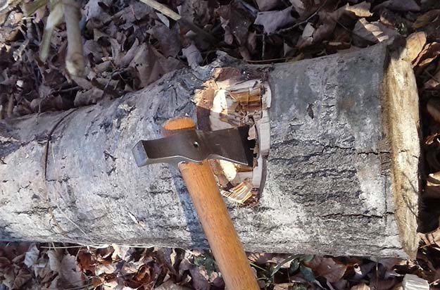 chopping wood with a tomahawk