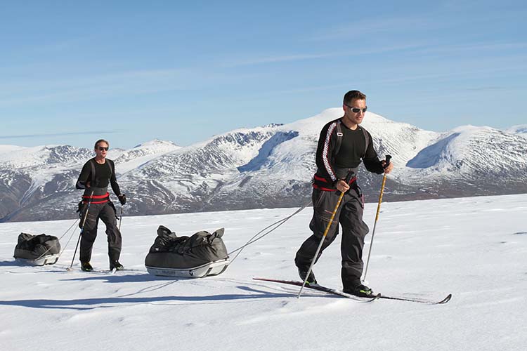 Inge Solheim and actor Alexander Skarsgard skiing in Norway