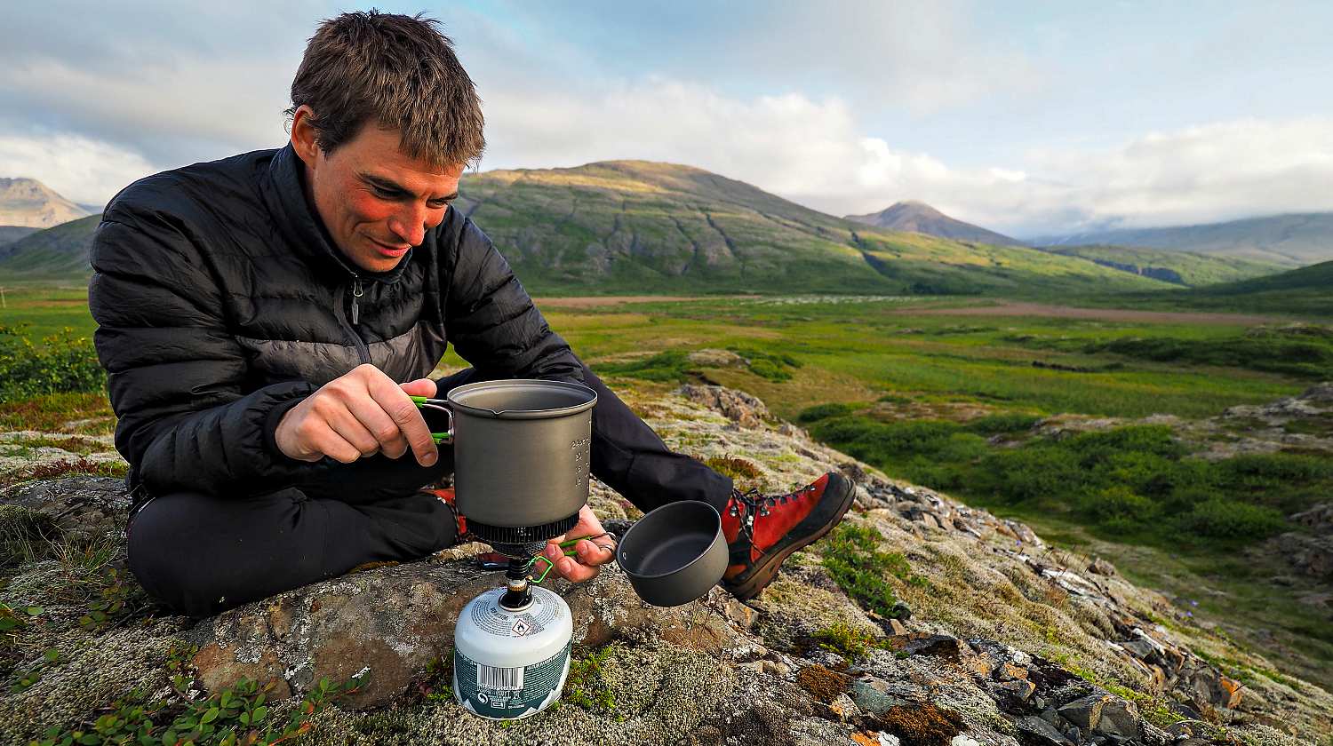 Feature | A man preparing to cook in the mountain | Improvised Survival Gear | DIY Projects For Preppers