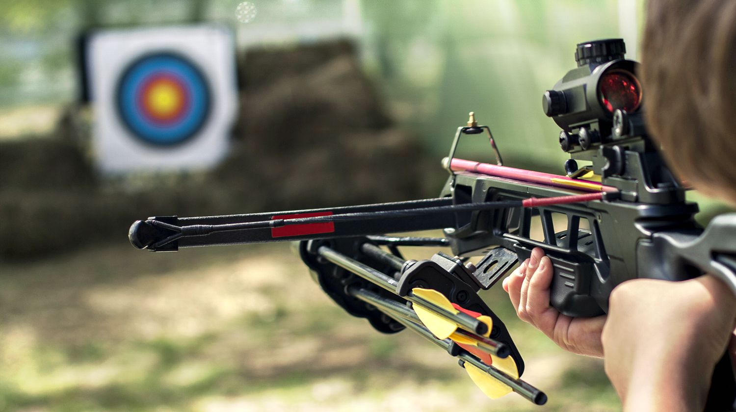 Featured | The shooter directed the crossbow towards the colored target | Crossbow Shooting 101: How To Improve Your Shooting Skills