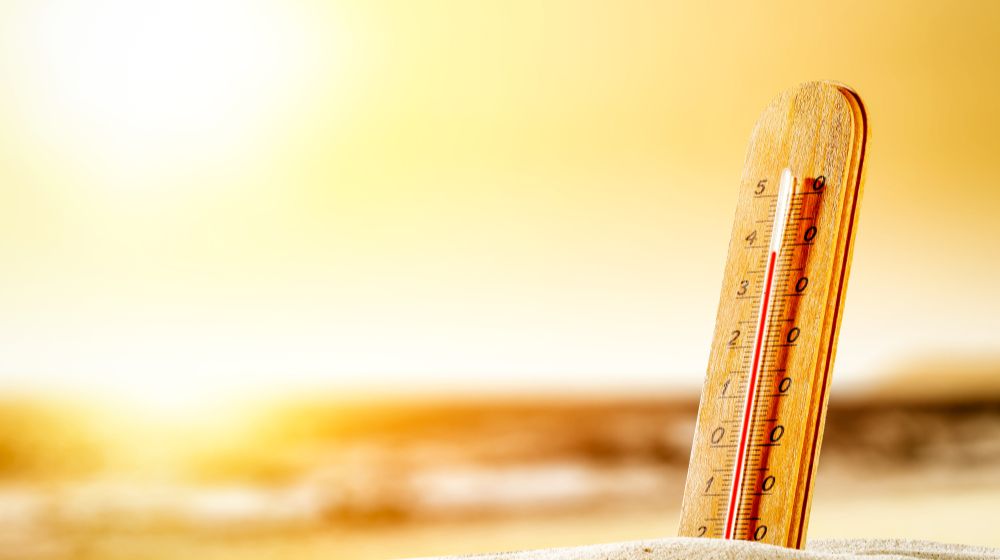 summer-thermometer-on-beach-free-space Heat Stroke Symptoms | Featured Image