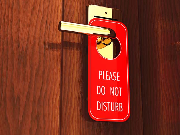 A do not disturb sign will make intruders think you are in the room even if you're not.