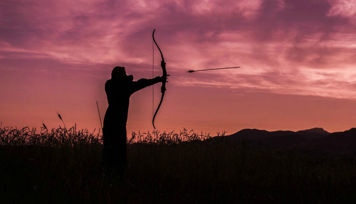 Archer in the sunset | Alaska Hunting Laws and Regulations