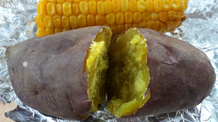 Outdoor Survival baked potato corn on aluminum foilcloseup ss