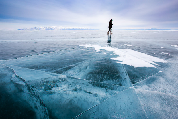 person-wakling-on-cracked-ice Thin Ice Ahead! How To Rescue Someone Who Has Fallen Through Ice
