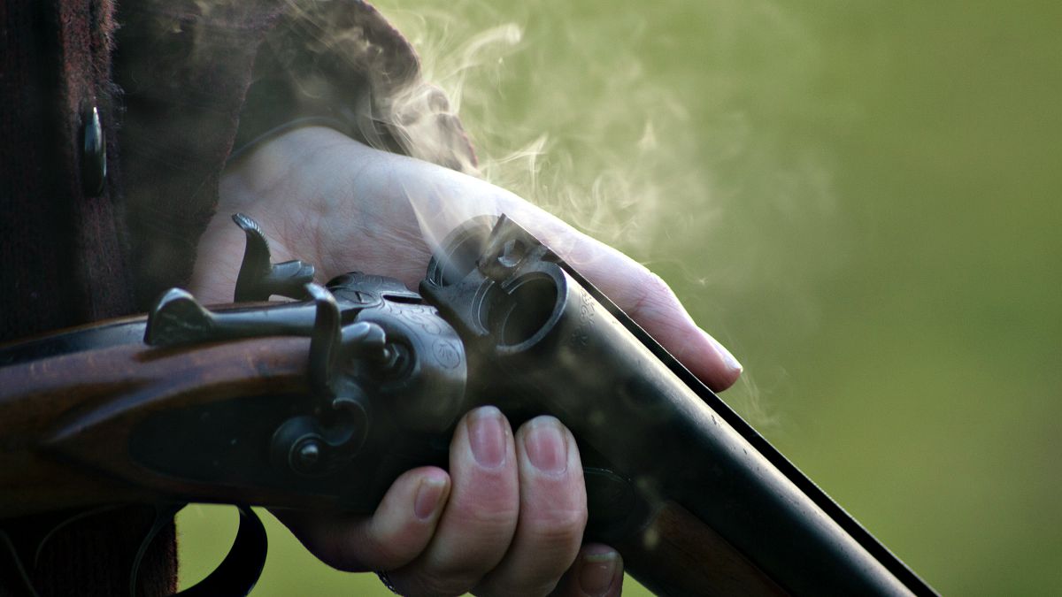 A person holding shotgun | These Hunting Shotguns Are The Best Bang For Your Buck
