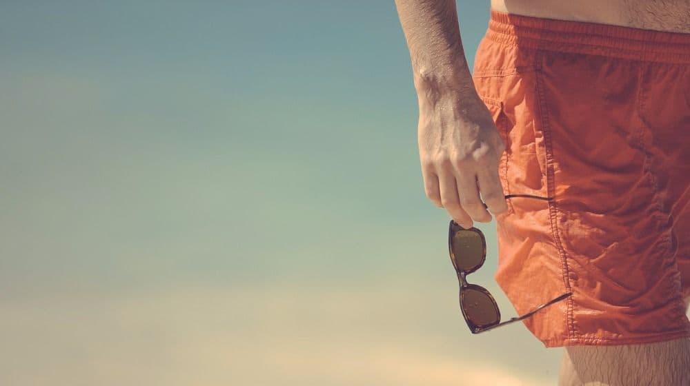 sun protection man beach red shorts bermudas pb