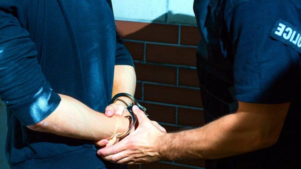 Handcuffed by a policeman criminal behavior feature getty