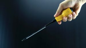 man hand holding yellow screwdriver on tool hacks ss FEATURE