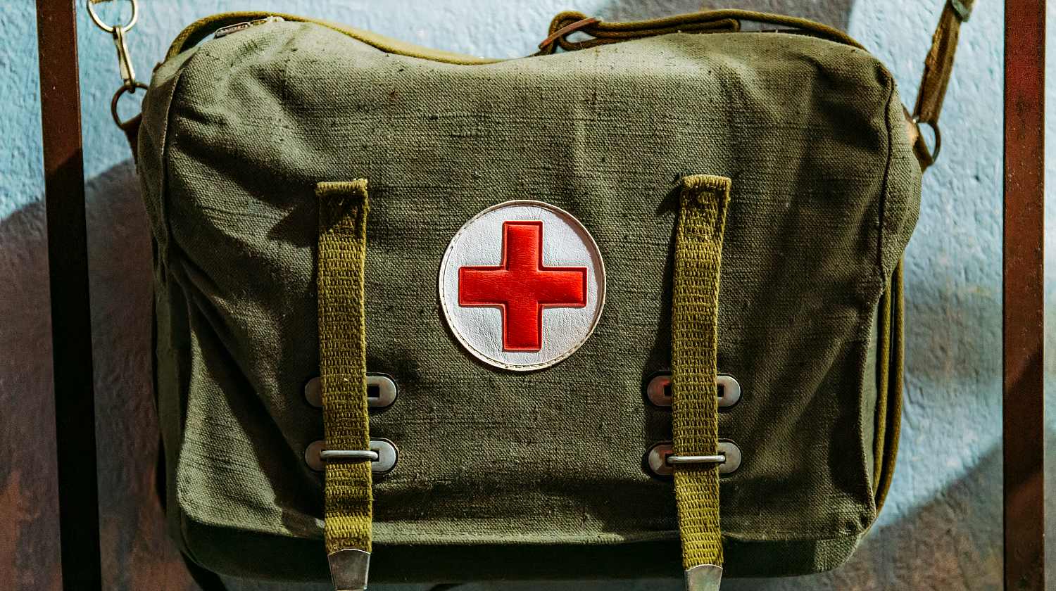 Feature | Vintage Soviet military medical bag with red cross, ancient emergency equipment | Do You Keep A Combat Casualty Kit In Your Go Bag?