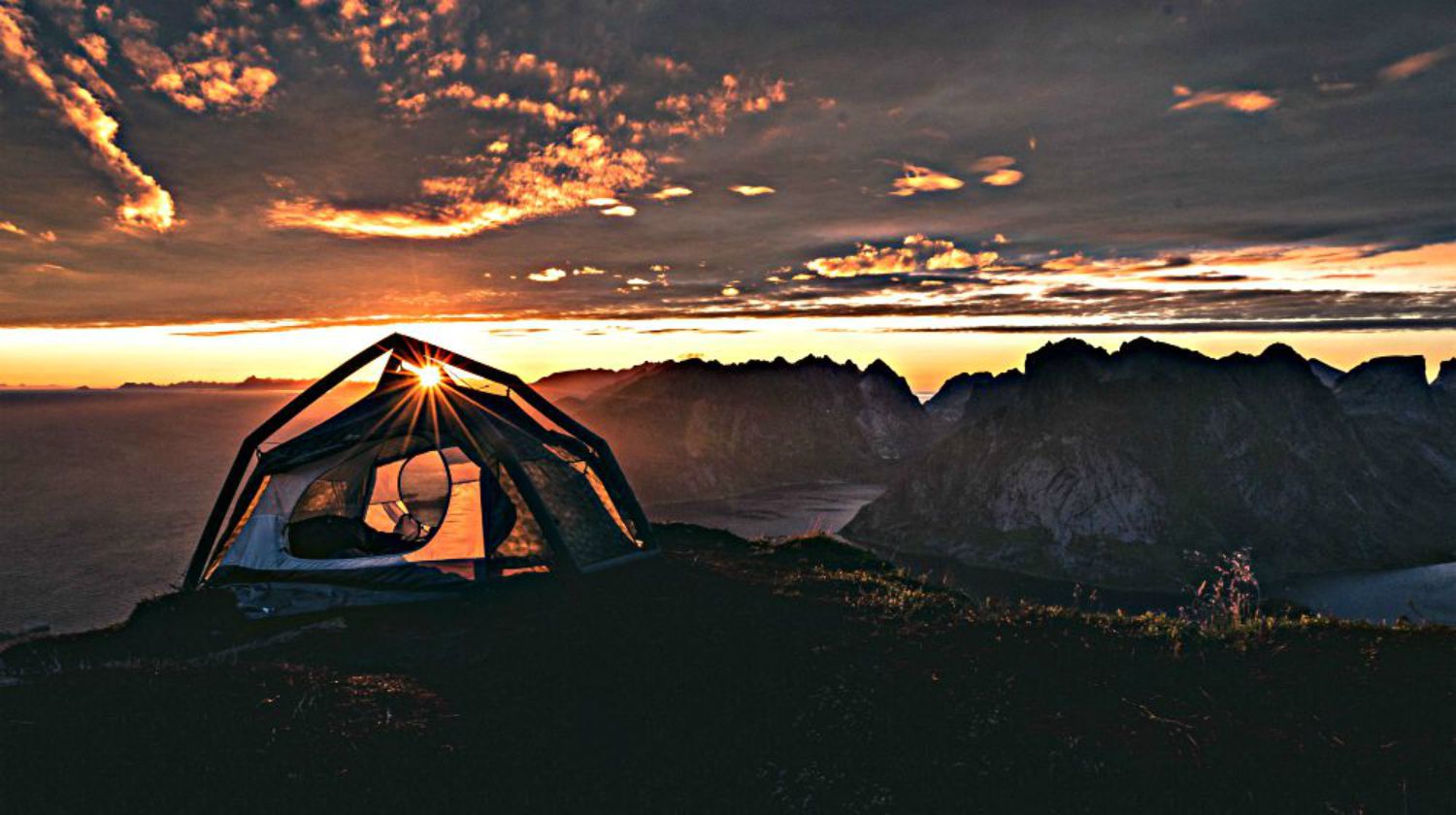 Feature | Tent in the middle trail top view of sunrise and mountain | Things You Need to Live Off the Grid