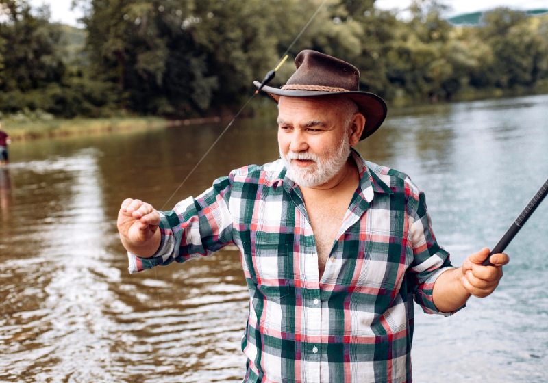 senior man fishing on lake fish | pvc projects for camping