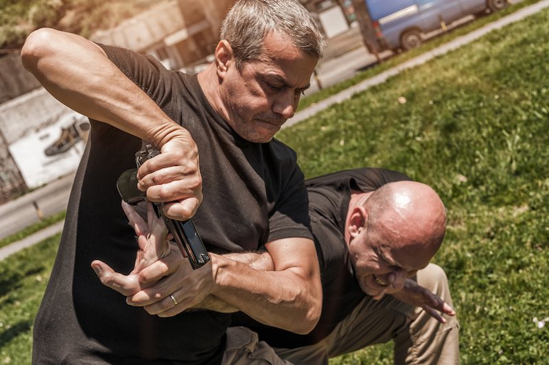 Kapap instructor demonstrates self defense techniques against a gun | gentleman's technique