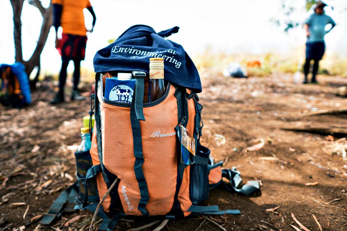 Blue and orange bag in the ground | The Ultimate Bug Out Bag List For Every Survivalist