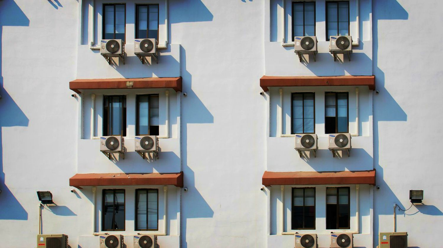 Feature | Hotel window with air conditioner | Ways To Keep Your House Cool During The Summer