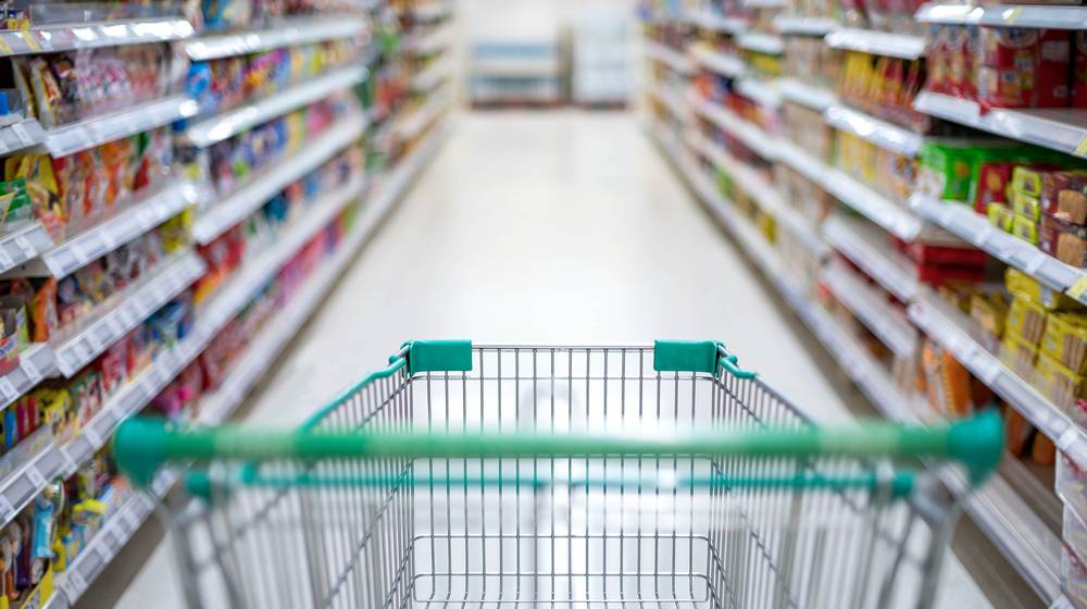 blurred effect supermarket aisle empty silver dollar tree prepper items | featured