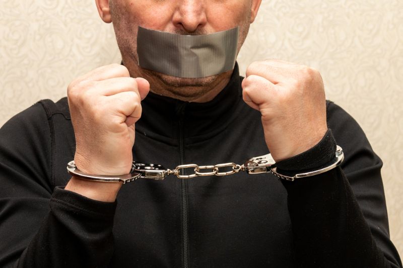 man-handcuffs-his-mouth-sealed-duct survival hacks 