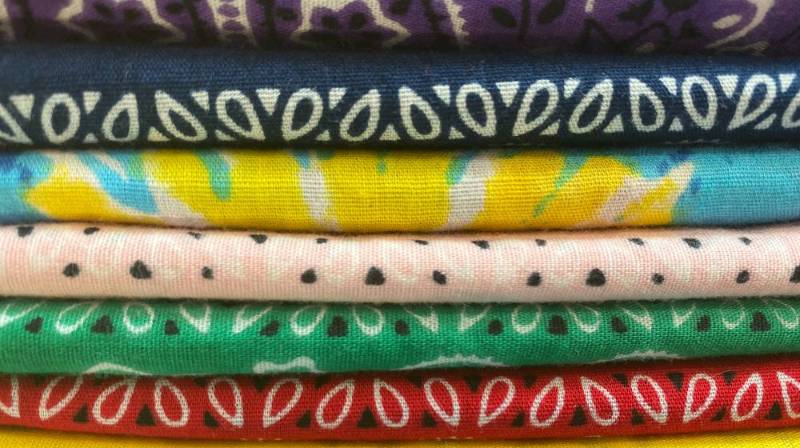 stack brightly colored cotton fabric bandanas Dollar Tree prepper items 