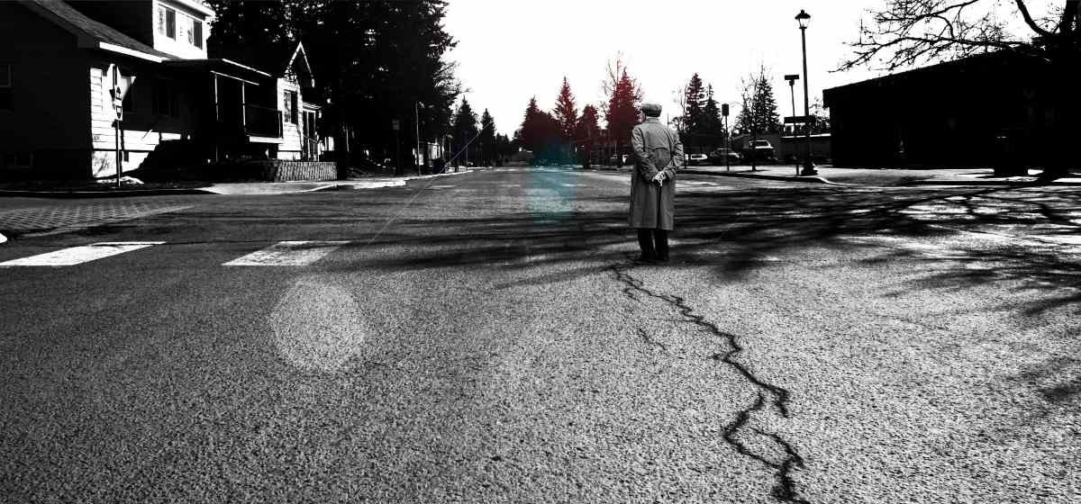 A man standing in the middle of the road | Sinkholes Survival Life Tips | How To Prepare For The Worst 