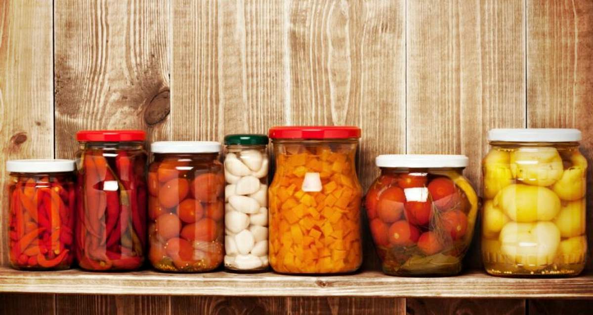 Marinated food in glass jars on a wooden shelf | Canning Jar | How To Guide To Canning