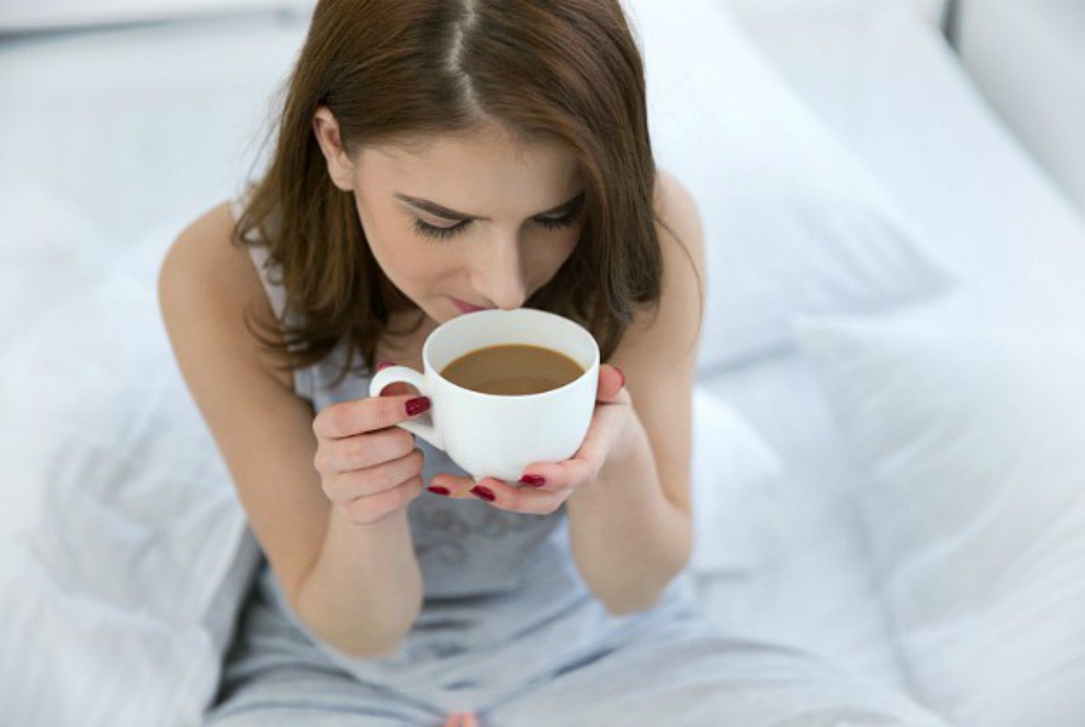Woman drinking her coffee | Surviving Sleep Deprivation