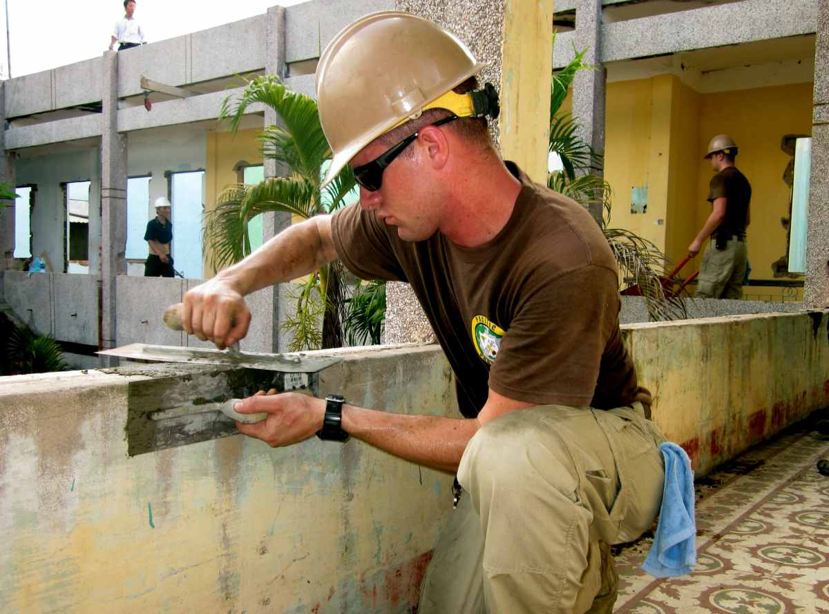 Man working papercrete | For Preppers, Papercrete Is The New Concrete