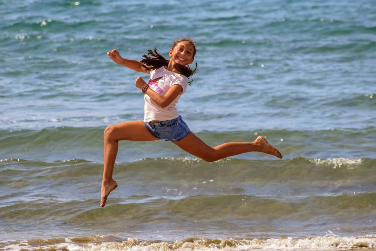 Happy running girl on the beach | Survival Uses For Peppermint Oil