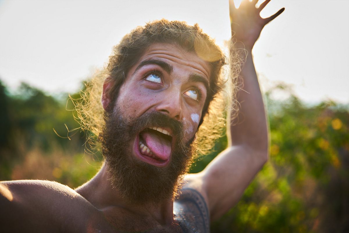 Man sticking his tongue | Got Beardruff? | Causes and Treatment For Beard Dandruff