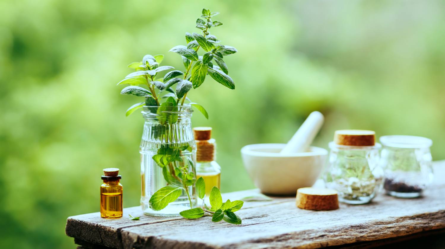 Feature | Essential Oil Peppermint Bottle on wooden table | Survival Uses For Peppermint Oil