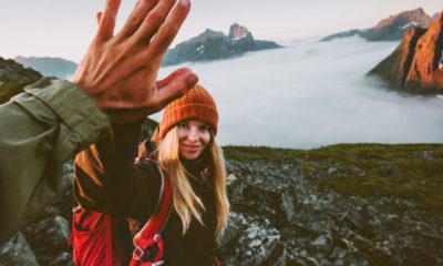 travel couple friends giving five hands Couples Defense | Featured Image