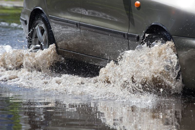 cars-driving-on-flooded-road-during flood survival 