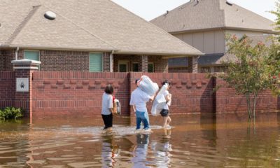 Featured Image | residents-walk-high-waters-after-devastating | flood survival tips