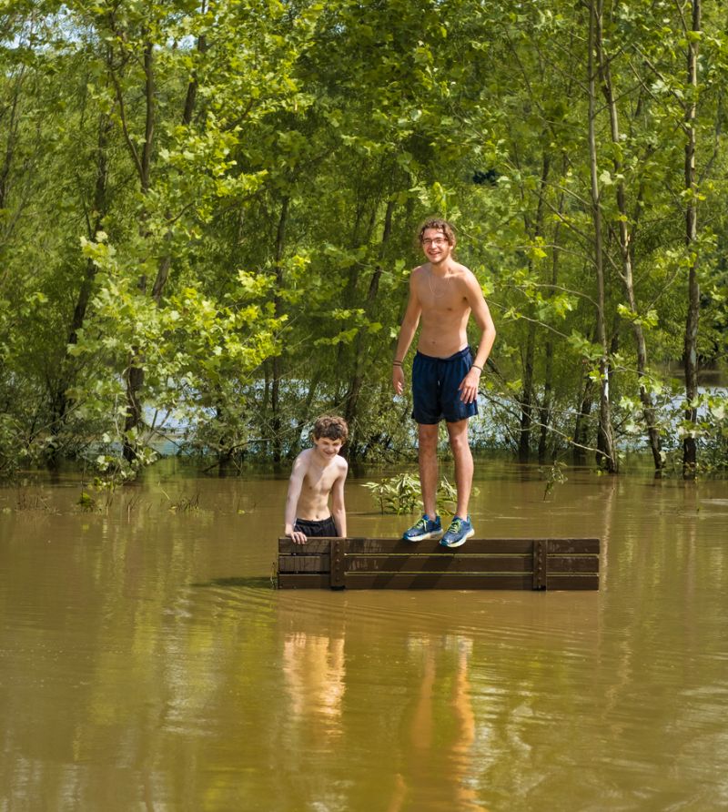 young-man-teenage-boy-standing-on flood survival 
