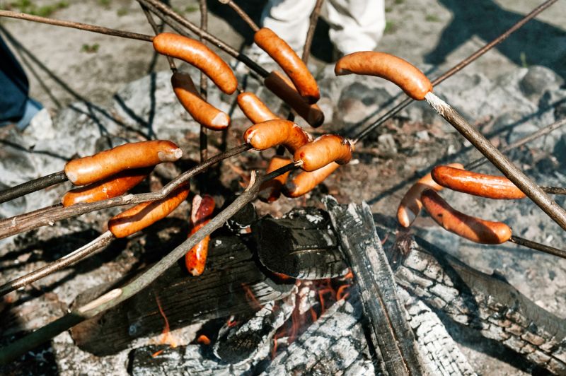 sausages-baked-on-campfire-forest-making | sausages