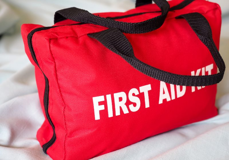 first aid kit closeup bag against | prepper supplies wholesale