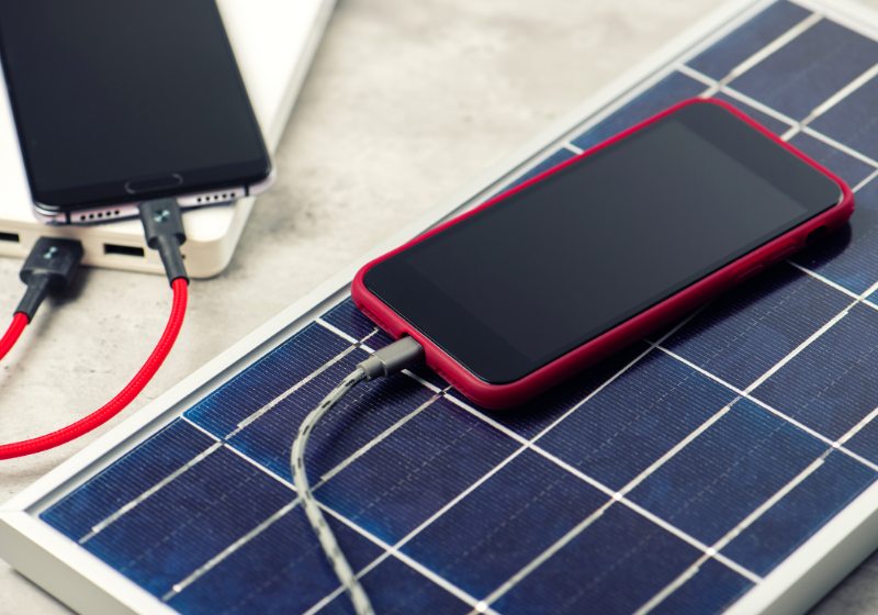 charging smartphone solar energy green concept | solar charger for phone