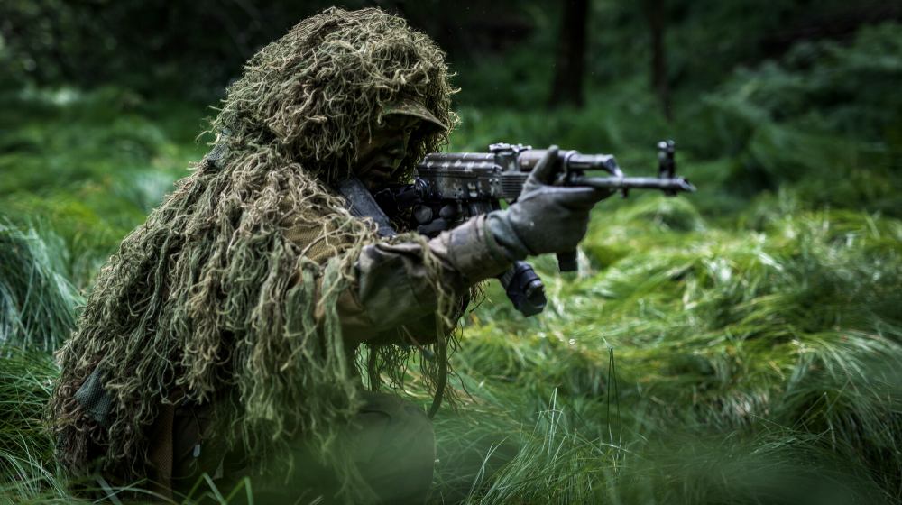 camouflaged commando assault forest soldier dressed | How To Make A Ghillie Suit From Scratch | featured