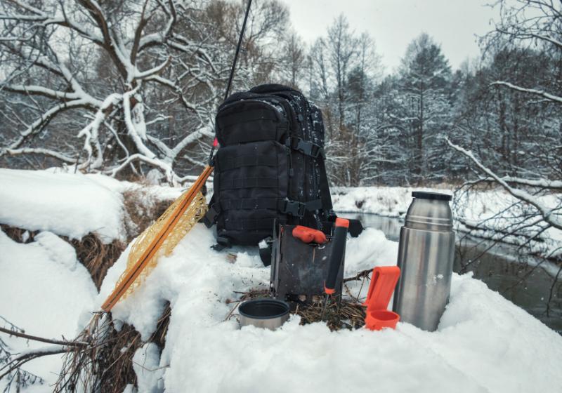 picnic on fishing trip snowcovered winter | best winter emergency car kit