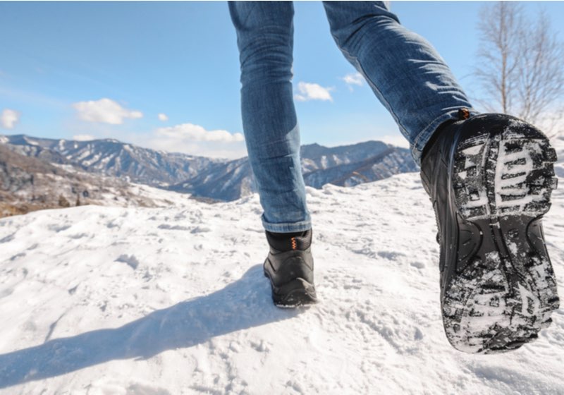 Boots going to the winter mountains. Close Up shot of the trekking shoes | best boots for ice