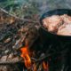 Steak in a pan on a fire. Cooking in nature. Picnic. Grill on fire | Campfire cooking