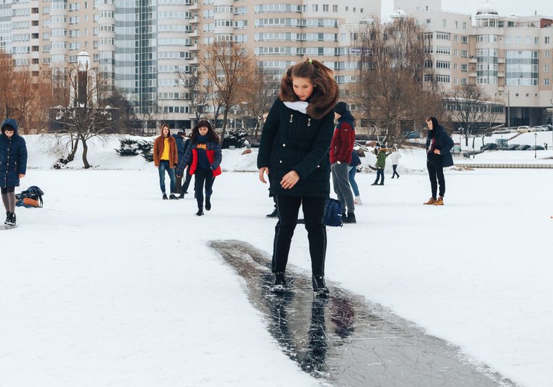 Walking on the ice of a frozen river Girl is riding on ice | Walking on Ice | SS-Featured