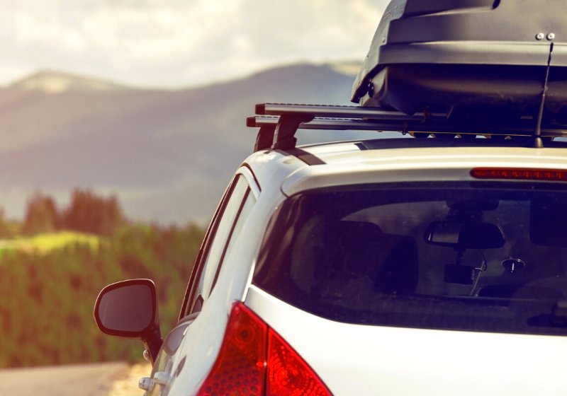 car traveling roof rack on mountain | wellness tips for the new year